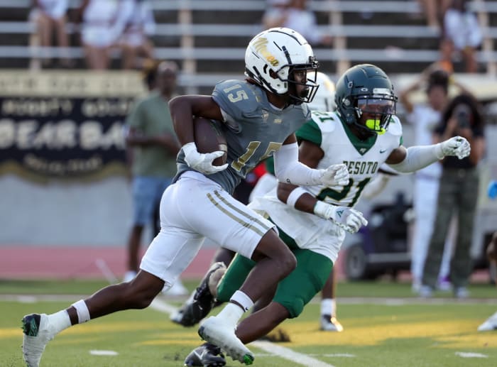 Senior receiver Davion Ennis gains ground in a loss to DeSoto in September.